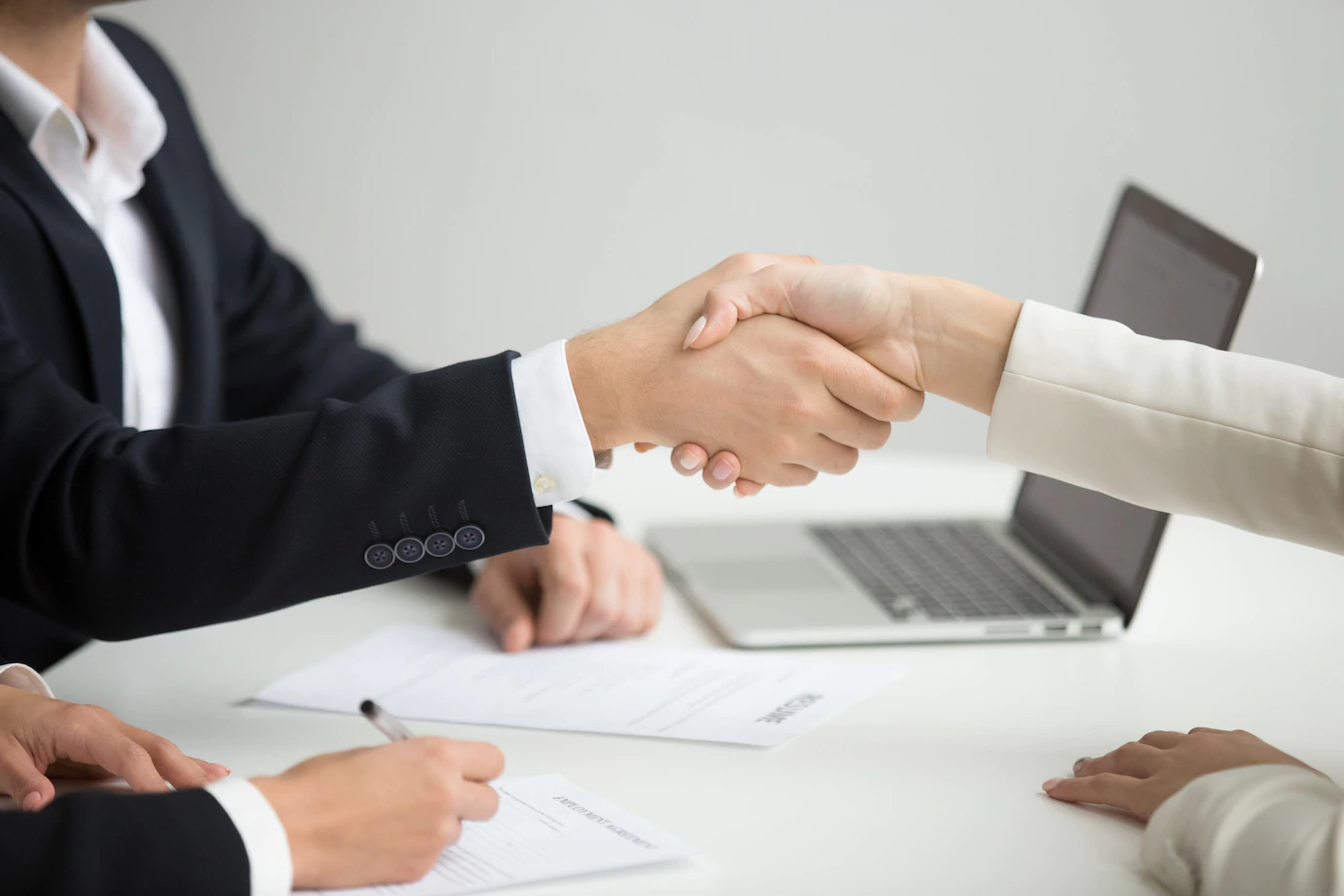 hr-handshaking-successful-candidate-getting-hired-new-job-closeup_1163-4688